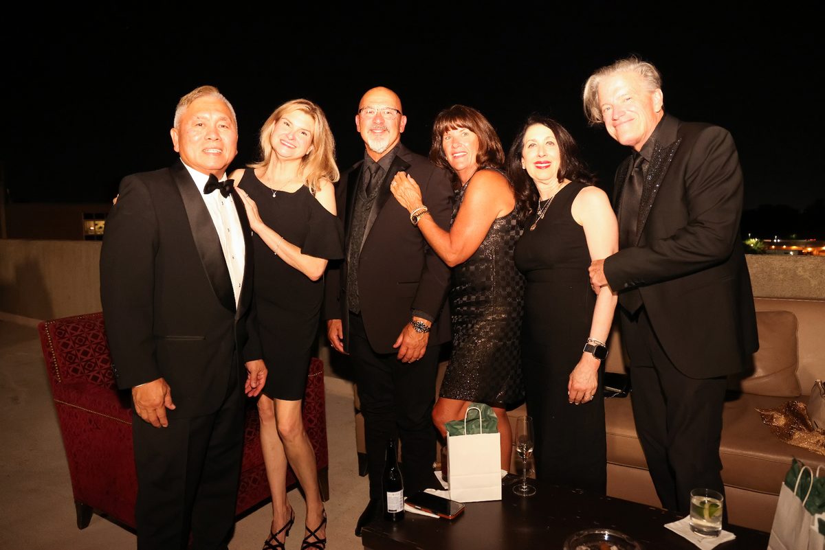 Group of guests gathered on the rooftop at the gala