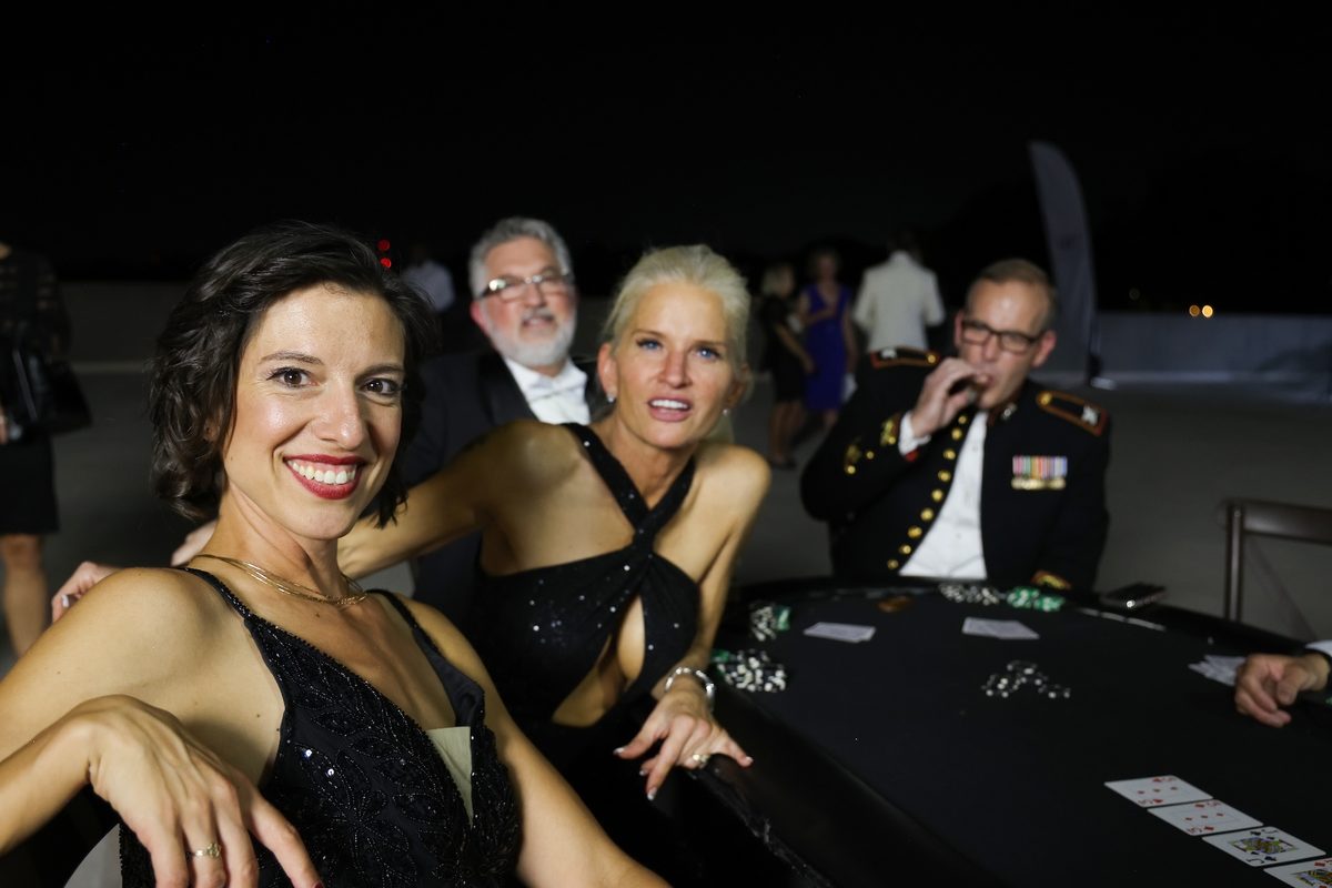 Guests enjoying the casino gaming tables