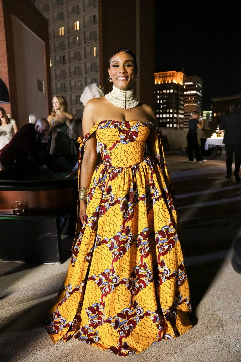 Guest in a patterned floor-length gown at the venue