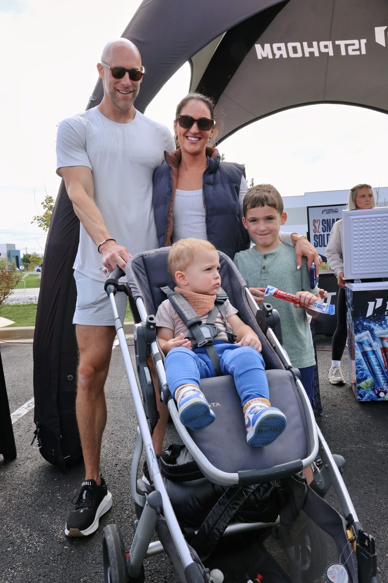 Family enjoying the car show together